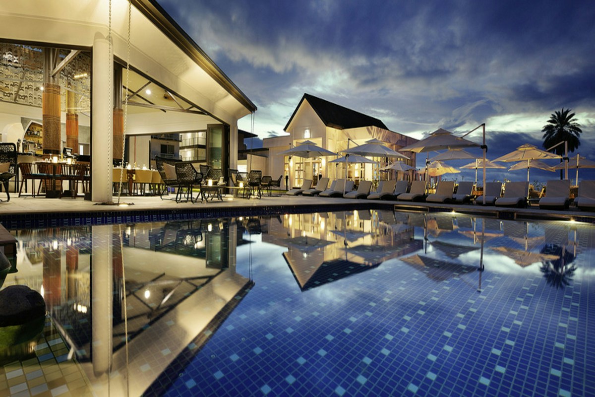 A resort pool and terrace at golden hour, the view a guest was looking at on the booking engine before they closed the tab