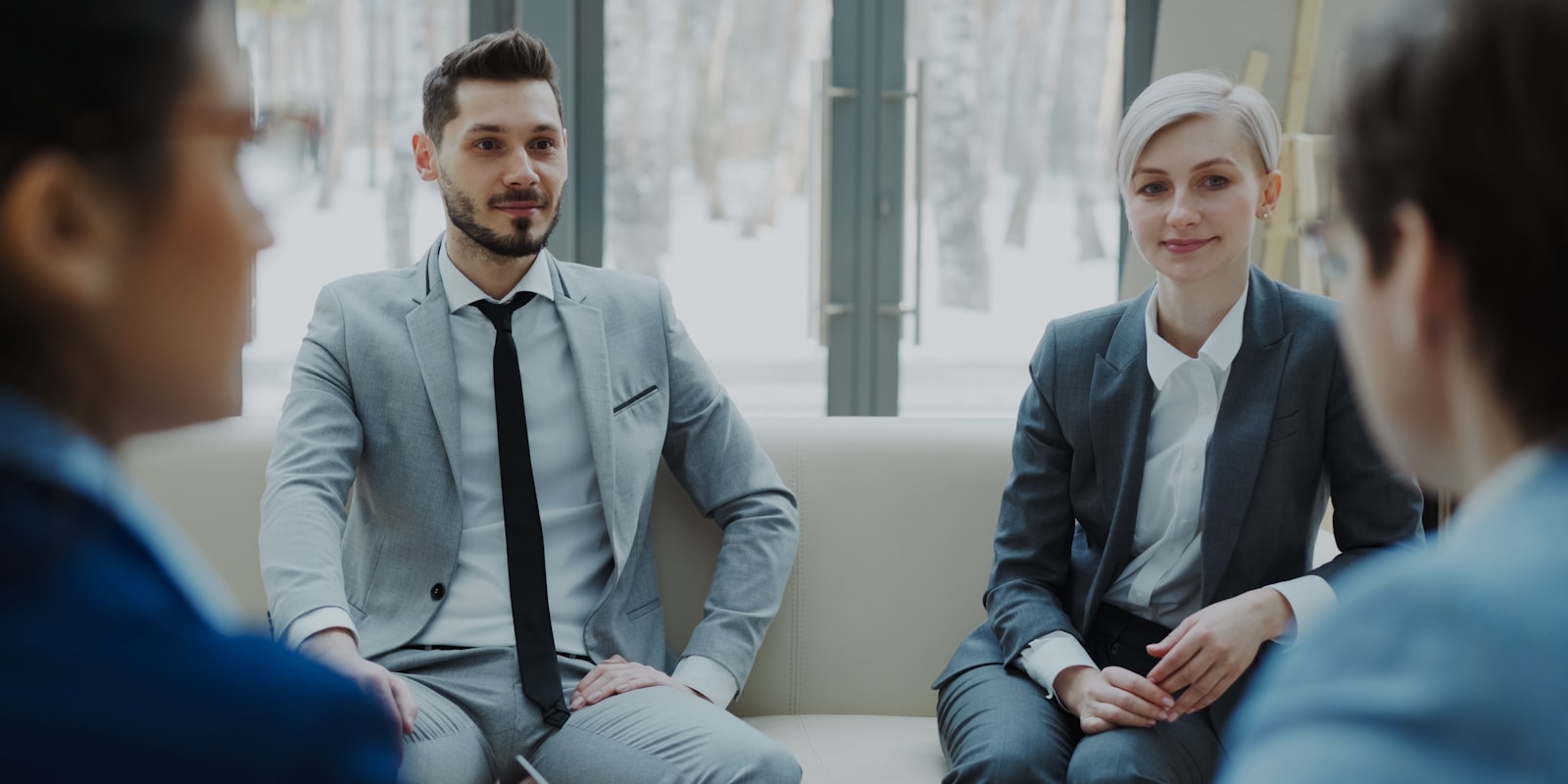 Hotel executives reviewing AI vendor contracts and evaluation scorecards in a boardroom