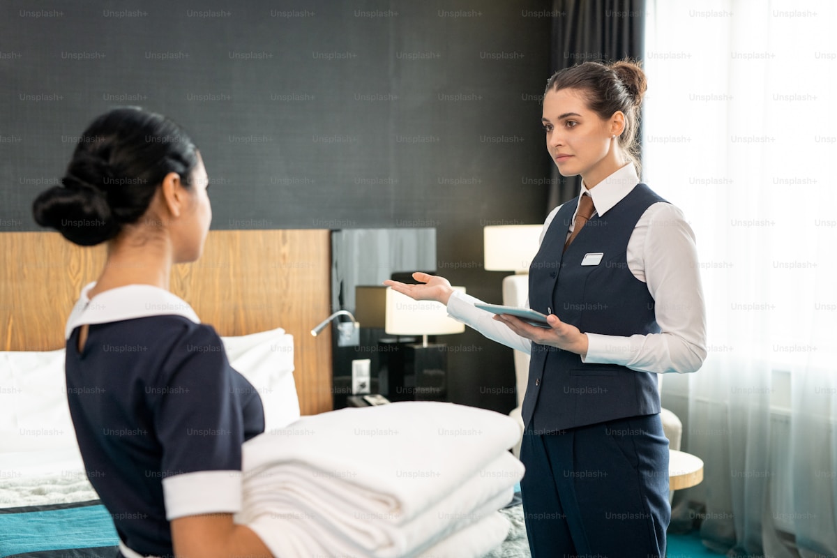 Hotel team members in training, learning to use new technology together at the property